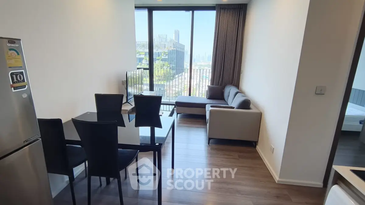Modern apartment living room with dining area and city view