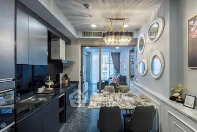 Luxurious modern kitchen and dining area with elegant chandelier and stylish decor