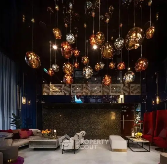 Luxurious modern living room with stunning chandelier and elegant seating area.