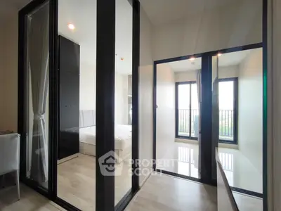 Modern bedroom with glass partitions and balcony view