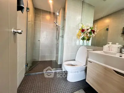 Modern bathroom with glass shower and elegant fixtures