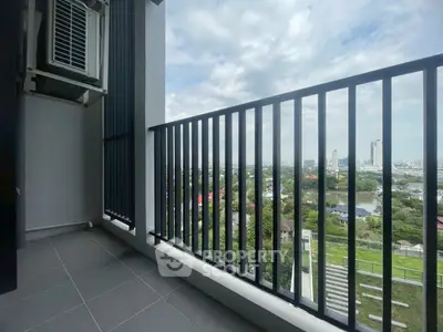 Spacious balcony with stunning city view, perfect for relaxation and enjoying the skyline.