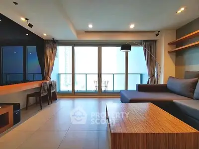 Spacious modern living room with large windows and stylish furniture