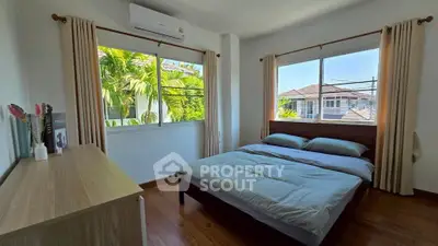 Bright and airy bedroom with large windows and modern decor