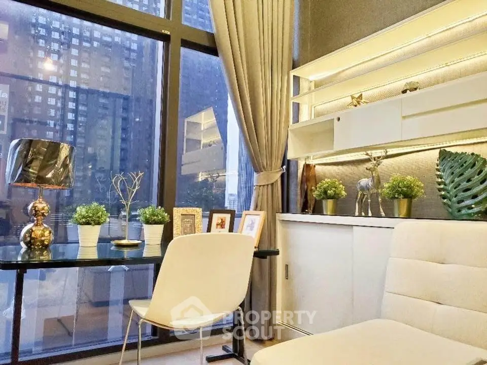 Modern living room with elegant decor and large windows offering city views.