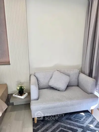 Cozy living room with modern gray sofa and stylish decor
