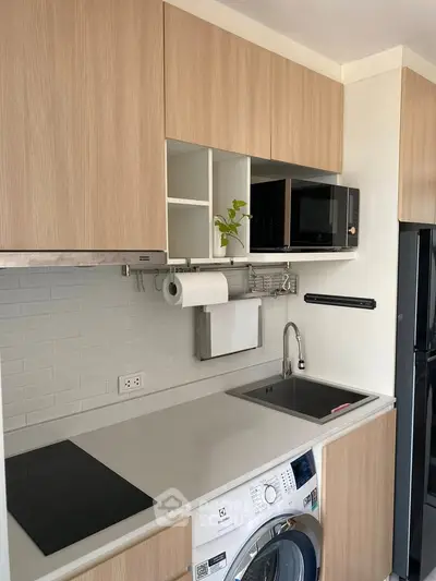 Modern kitchen with sleek cabinetry, integrated appliances, and efficient layout.