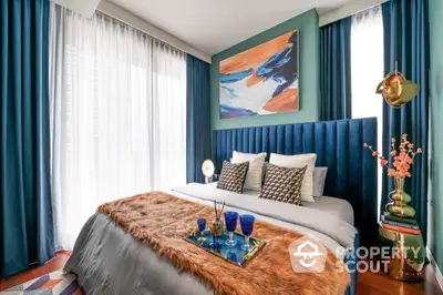 Luxurious bedroom with stylish decor and vibrant colors, featuring a plush bed and elegant lighting.