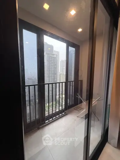 Modern high-rise apartment balcony with city skyline view