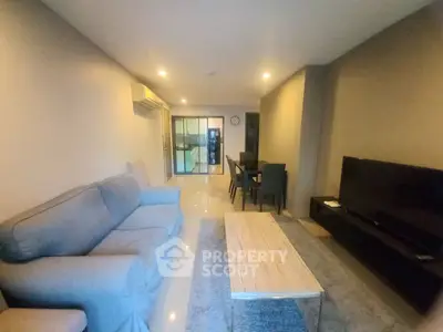 Spacious living room with modern furniture and open layout