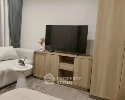 Modern living room with sleek TV stand and cozy sofa