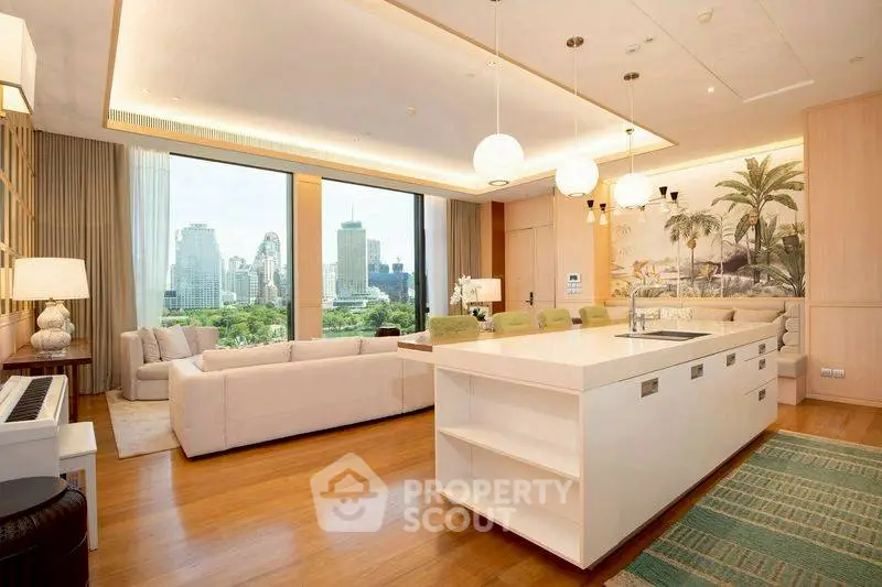 Luxurious open-plan living room with stunning city view and modern kitchen island.