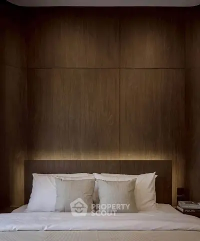 Luxurious bedroom with elegant wood paneling and soft ambient lighting