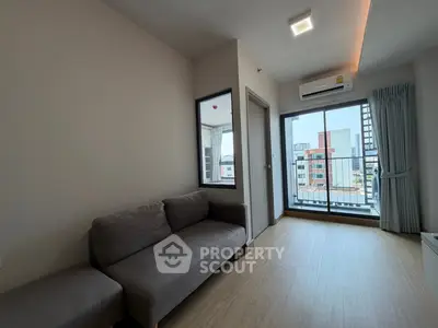 Modern living room with balcony view in urban apartment