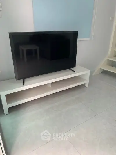 Modern living room with sleek TV stand and minimalist decor