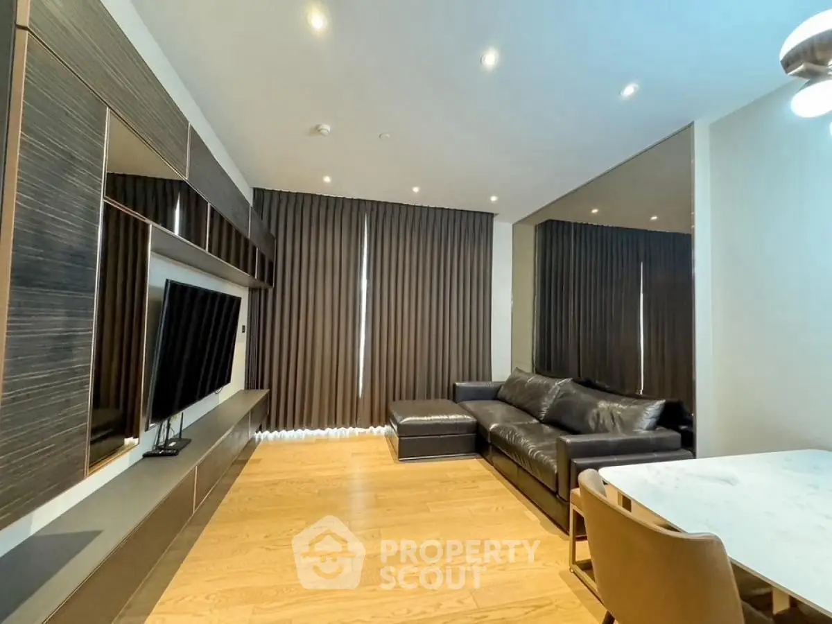 Modern living room with sleek furniture and wooden flooring