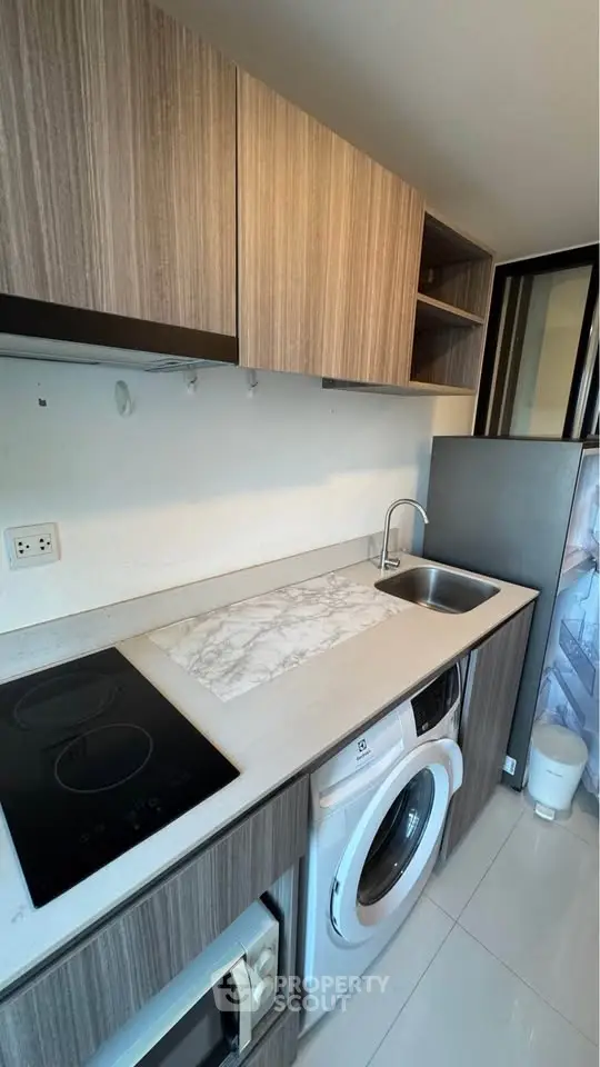 Modern kitchen with sleek cabinetry, built-in appliances, and elegant countertop design.