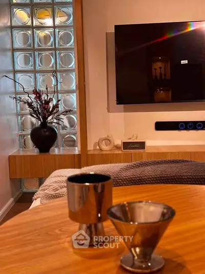 Stylish modern living room with sleek decor and wall-mounted TV
