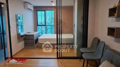 Modern apartment with glass partitioned bedroom and stylish decor