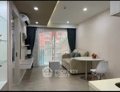 Modern living room with cozy sofa, dining table, and large window with curtains.