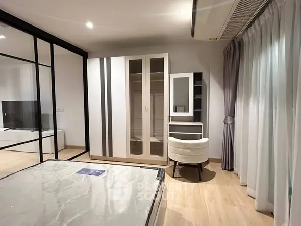 Modern bedroom with stylish wardrobe and elegant decor