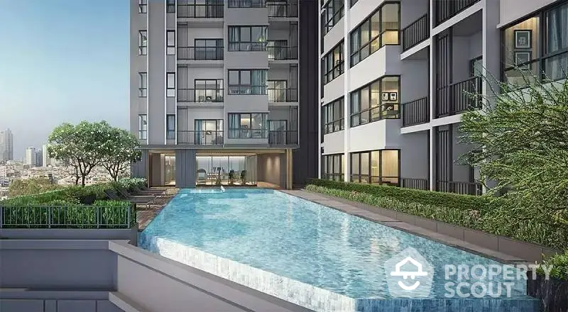 Luxurious modern apartment building with stunning pool and city view.