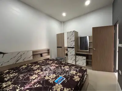 Modern bedroom with stylish marble accents and cozy lighting