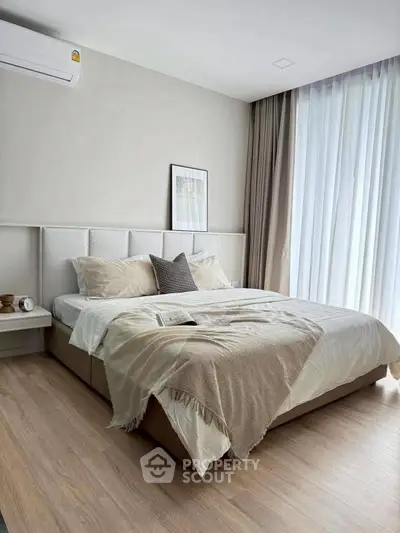 Modern bedroom with cozy decor and natural light