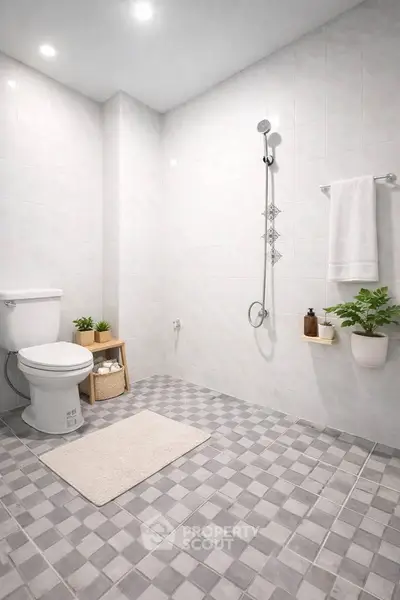 Modern minimalist bathroom with sleek fixtures and stylish tile flooring.