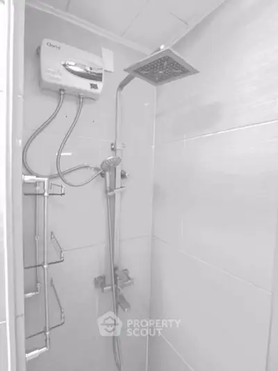Modern bathroom with sleek shower fixtures and water heater