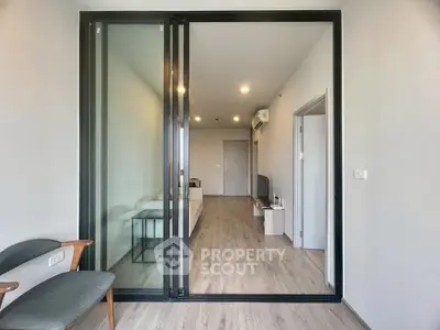 Modern apartment interior with sliding glass doors and stylish furniture