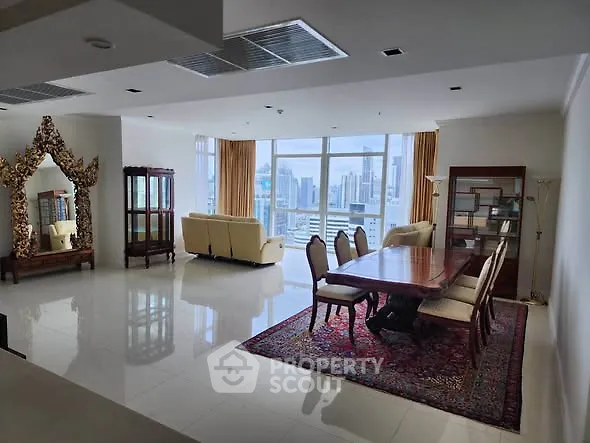 Luxurious living room with elegant dining area and stunning city view.