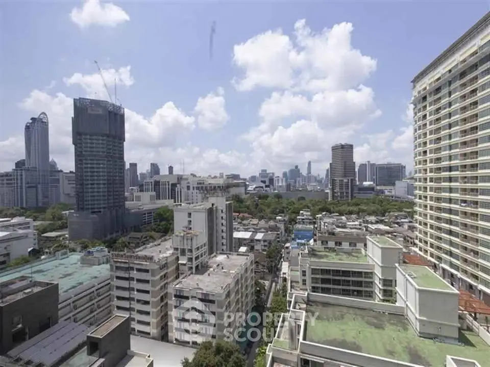 Stunning cityscape view from high-rise building showcasing urban skyline and architectural diversity.