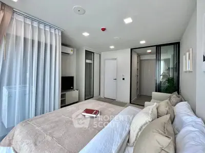 Modern bedroom with elegant decor and spacious layout in a luxury apartment.