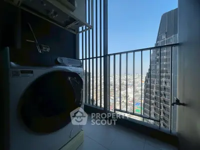 High-rise balcony with city view and washing machine, perfect for urban living.