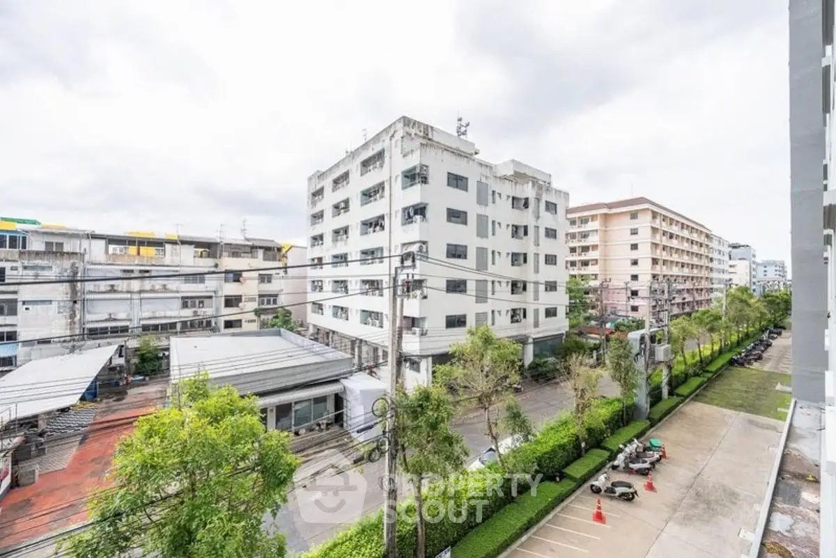 Urban residential buildings with street view and greenery