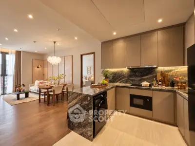 Luxurious open-plan kitchen and living area with modern design and elegant lighting.