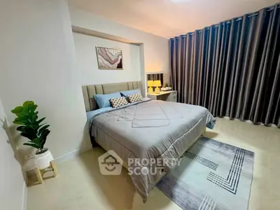 Modern bedroom with stylish decor and cozy ambiance, featuring a plush bed and elegant curtains.