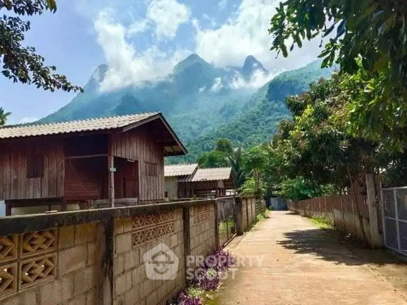 Charming rustic wooden houses with stunning mountain views, perfect for serene living or vacation retreat.