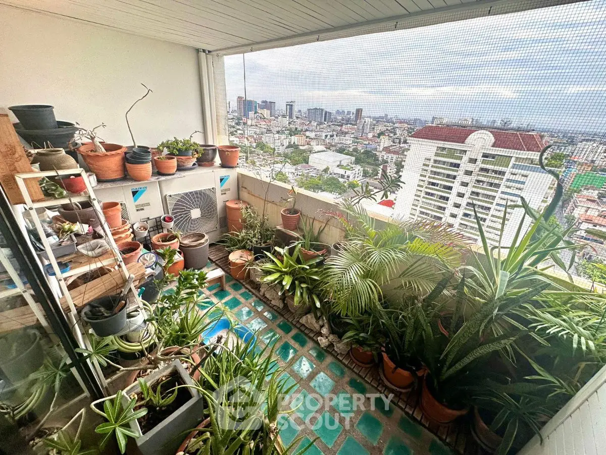 Charming balcony garden with city view, perfect for urban plant lovers seeking a serene escape.