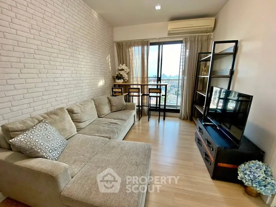 Modern living room with city view, cozy sofa, and stylish decor