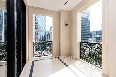 Luxurious balcony with ornate railings and cityscape view, perfect for urban living.
