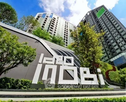 Modern high-rise building with lush greenery at Sukhumvit East Gate.