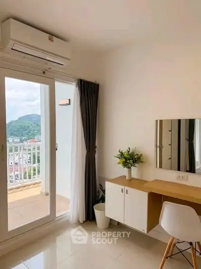 Bright study room with balcony view and modern desk setup