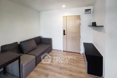 Modern living room with sleek furniture and wooden flooring