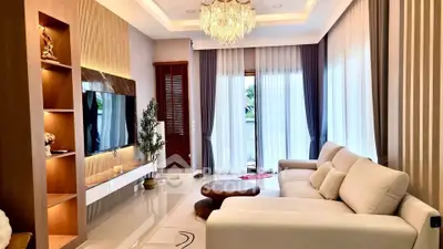 Luxurious living room with elegant chandelier and modern decor