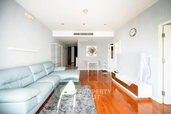 Spacious modern living room with sleek furniture and wooden flooring