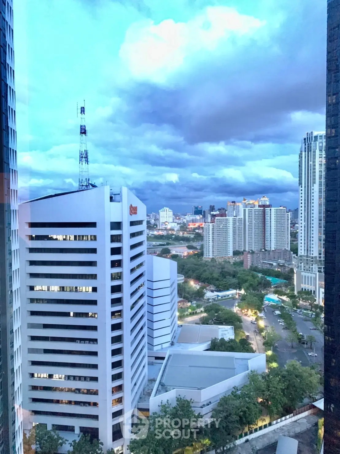 Stunning cityscape view from high-rise building with dramatic sky