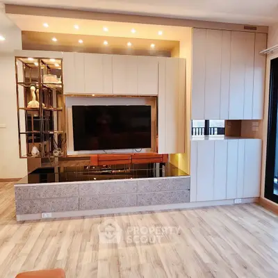 Modern living room with sleek built-in entertainment center and stylish lighting
