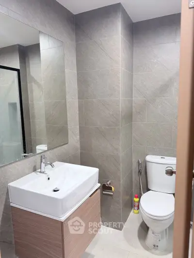 Modern bathroom with sleek fixtures and neutral tile design